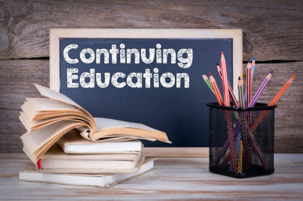 ‘Continuing education’ written on a chalkboard.