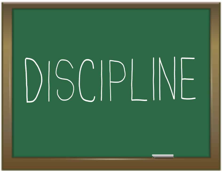 ‘Discipline’ written on a green chalkboard.