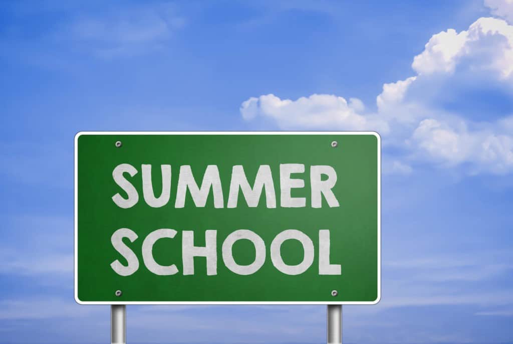 “Summer School” written on a green sign outside.