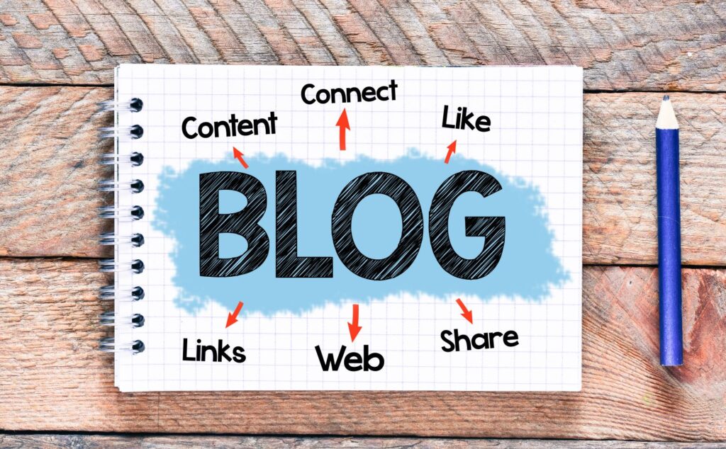 A pad of paper that has, “blog: content, connect, like, links, web, share” written on it.