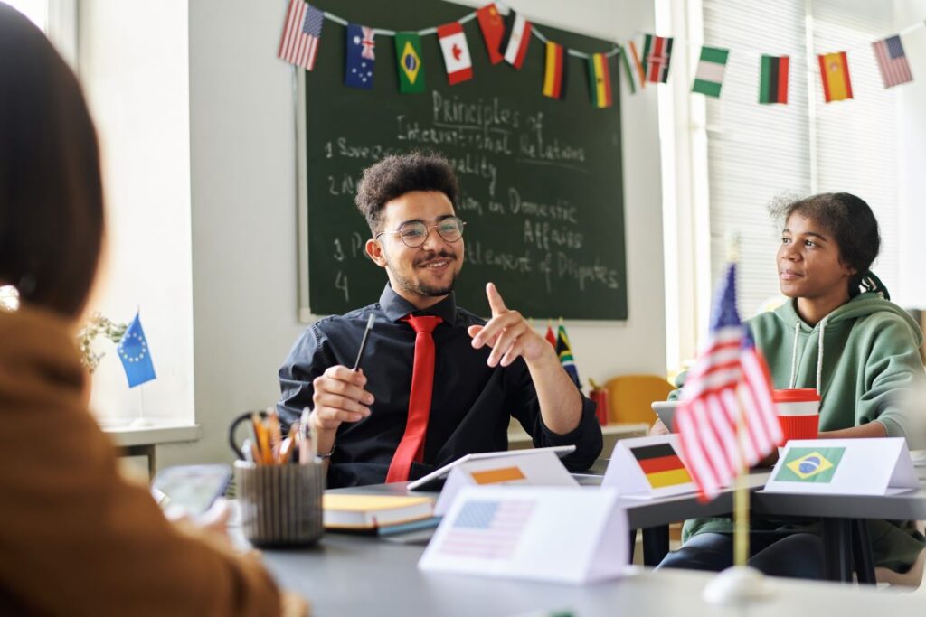 A teacher talks to his students about social studies.