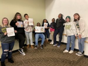 Point Park University students pose for a photo with Pittsburgh Faison students after facilitating a mini-lesson.